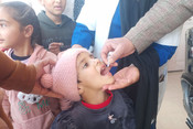 POONCH, MAR 3 (UNI):- A health worker administers oral polio vaccine to a child during a vaccination drive as a part of an ongoing polio eradication program at Poonch area of Jammu and Kashmir, on Sunday. UNI PHOTO-19U