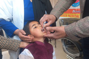 POONCH, MAR 3 (UNI):- A health worker administers oral polio vaccine to a child during a vaccination drive as a part of an ongoing polio eradication program at Poonch area of Jammu and Kashmir, on Sunday. UNI PHOTO-20U