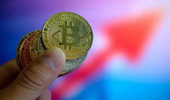 Bitcoin tops $77,000 for first time in history