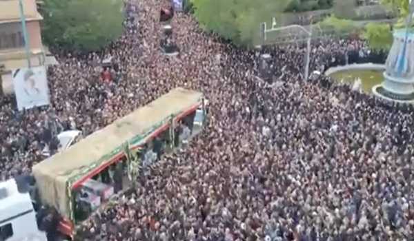 People in Iran's capital bid farewell to late president