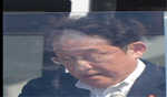 Japan's PM speaks behind bulletproof glass over security concerns