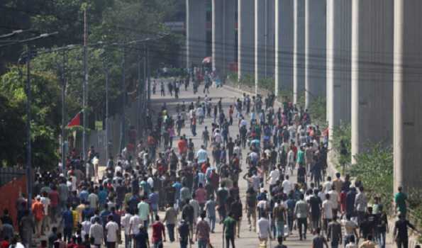 Protesters set fire to Awami League party buildings, pull down statue of Sheikh Mujibur Rahman