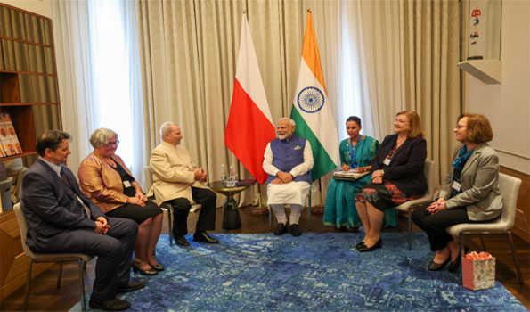 PM Modi meets noted Polish Indologists, business honchos in Warsaw