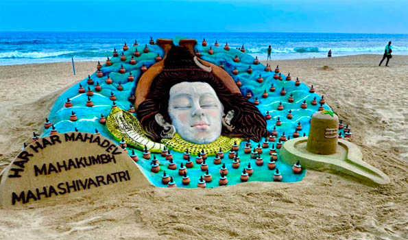 Sudarshan creates a six-feet-high sand sculpture at Puri Beach on Maha Shivaratri