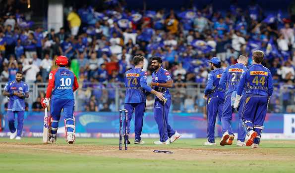 Mumbai Indians crush DC to seal playoff spot