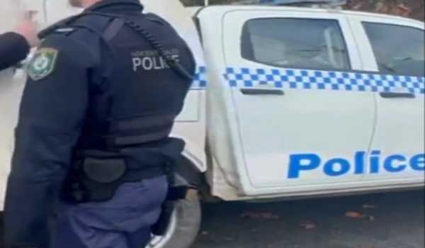 Man arrested over stabbing following crash north of Sydney