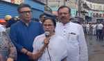 Mamata visits badly burnt market, announces aid