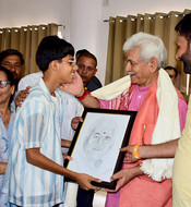 JAMMU, JUN 15 (UNI):- A boy presenting a sketch of Lieutenant Governor Manoj Sinha to him at an event in Bishnah at Jammu on Sunday. UN PHOTO-60U JAMMU, JUN 15 (UNI):- A boy presenting a sketch of Lieutenant Governor Manoj Sinha to him at an event in Bishnah at Jammu on Sunday. UN PHOTO-60U